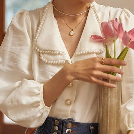 1742824324777250816 New French Style Retro Design Niche Bubble Sleeve Elegant Top